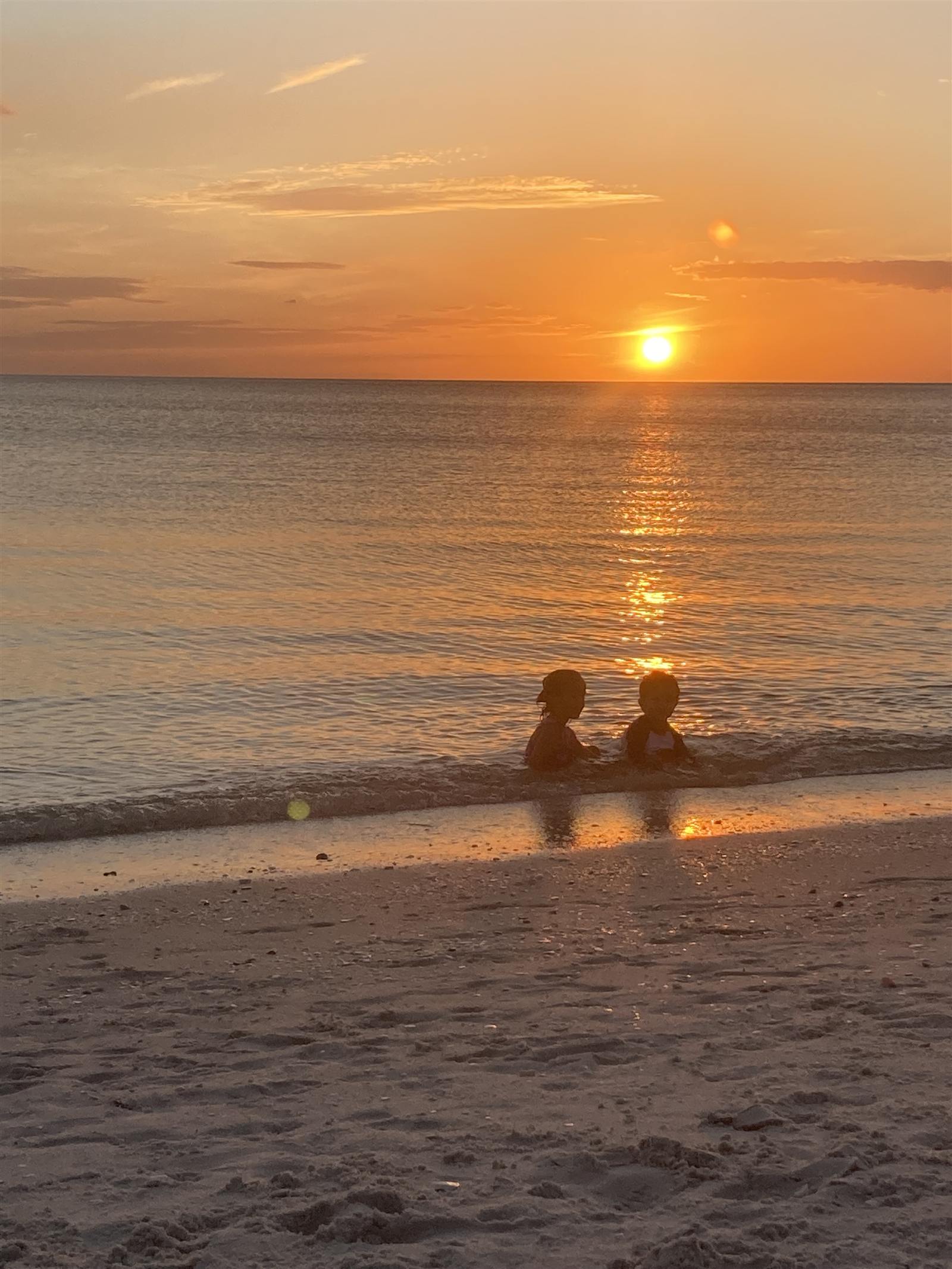 Sunset over the water at the beach