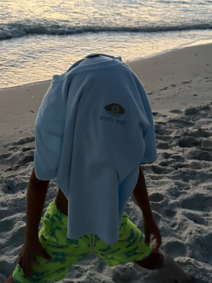 A youth hoodie on the beach